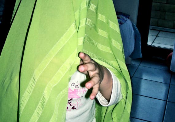 girl under blanket