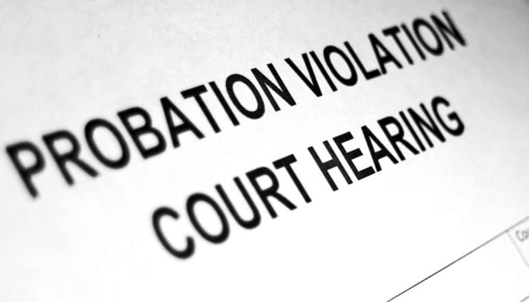 paper says "probation violation court hearing"