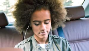 teen girl in backseat of car