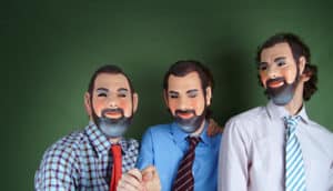 three men wear the same mask