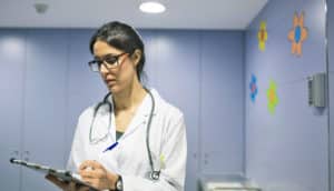 doctor in purple exam room