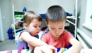 siblings doing crafts