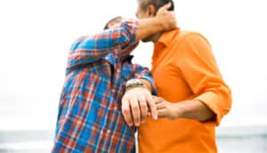 couple shows off wedding bands