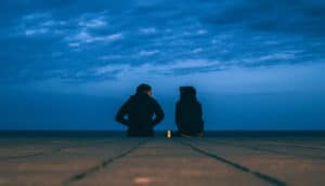 couple and stormy blue sky
