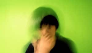man sneezing on green