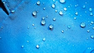 water droplets on blue fabric