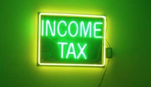 green neon income tax sign