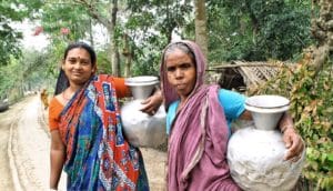 women with water jugs in Bangladesh