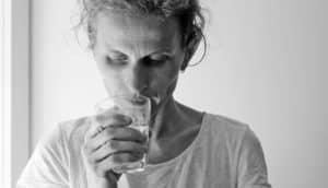 woman with glass in bw