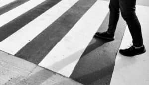 person walks on crosswalk