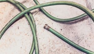 green hose on on concrete
