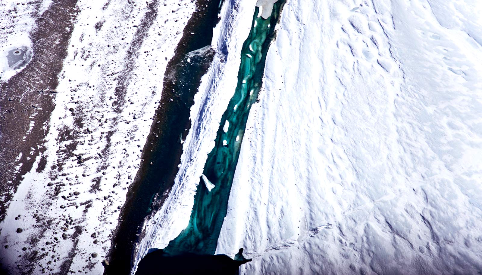 icy river flowing through ice