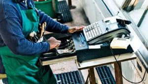 man using cash register