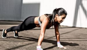 woman does plank exercise
