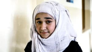 Syrian girl in hallway
