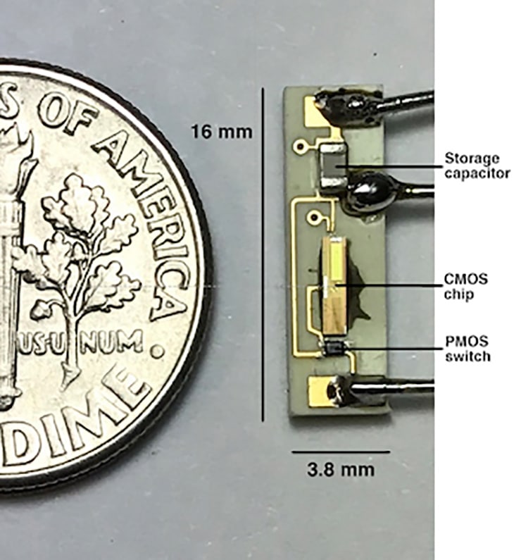 battery-free pacemaker components next to dime