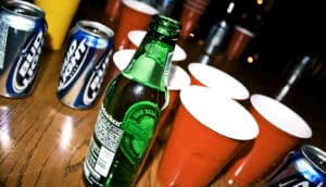 red solo cups and beers on table