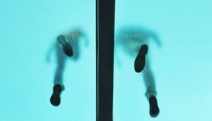 feet through translucent blue floor