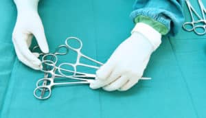 surgeon hands and instruments