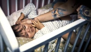 mom comforting crying baby