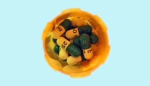 overhead shot of a pill bottle on blue background