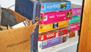 clutter: board games and box in closet