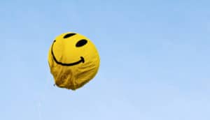 yellow smiley balloon looks deflated