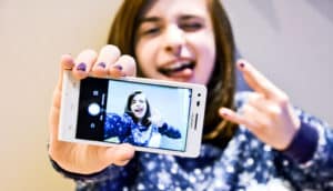 teen taking a selfie