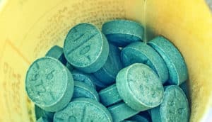 adhd medication blue pills, yellow bottle