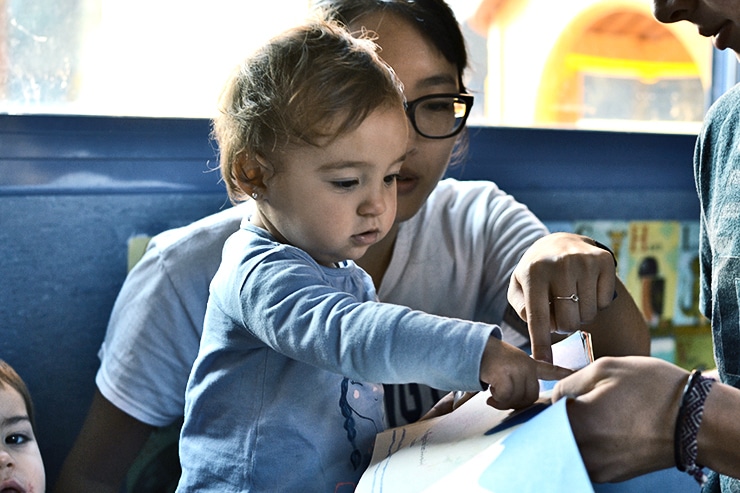 baby recognizing word in book