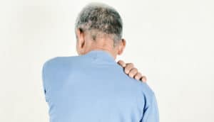 man holding his back