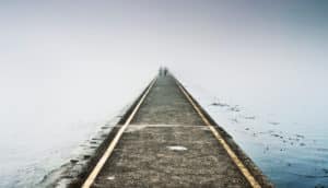 extinction concept: cement path into the fog