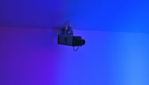 security camera in blue/purple room