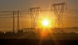 sunset behind power lines