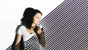 woman with striped light pattern