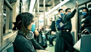 woman wearing medical mask on the subway