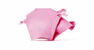 pink origami pig on white