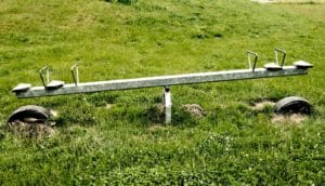 metal seesaw and grass