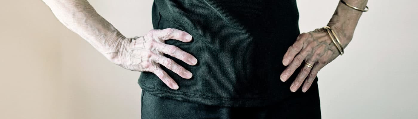 senior woman hands on hips