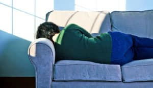 woman asleep on couch