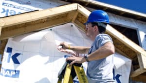 man working on house