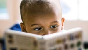 young boy reading