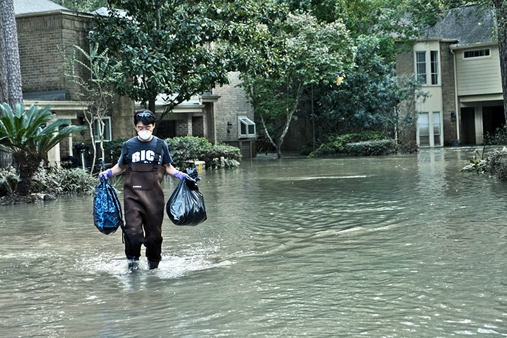 carrying bags through flooding