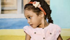 little girl tilting head