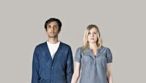 serious couple on beige