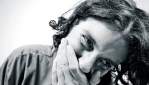 woman covering mouth