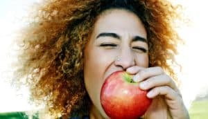 woman eats apple