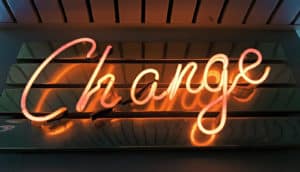 neon sign that says "Change"