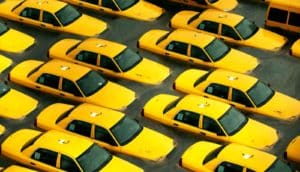 yellow cabs in flood water