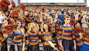 football fans in orange and blue bodypaint